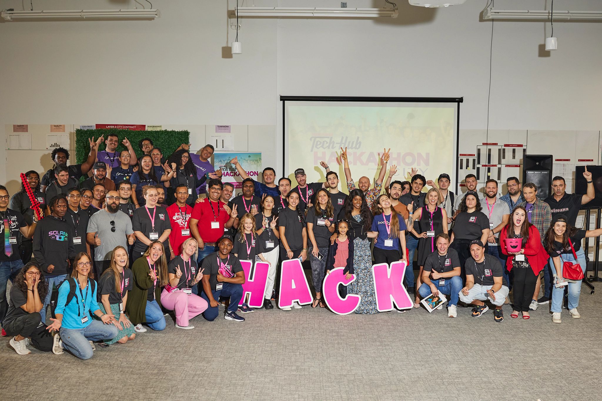 Huge group picture with about 150 people cheering